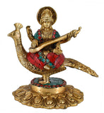 White Whale Maa Saraswati Sitting On Peacock Brass Statue With Multicolor Stone Work Religious Goddess Sculpture Idol Home Décor